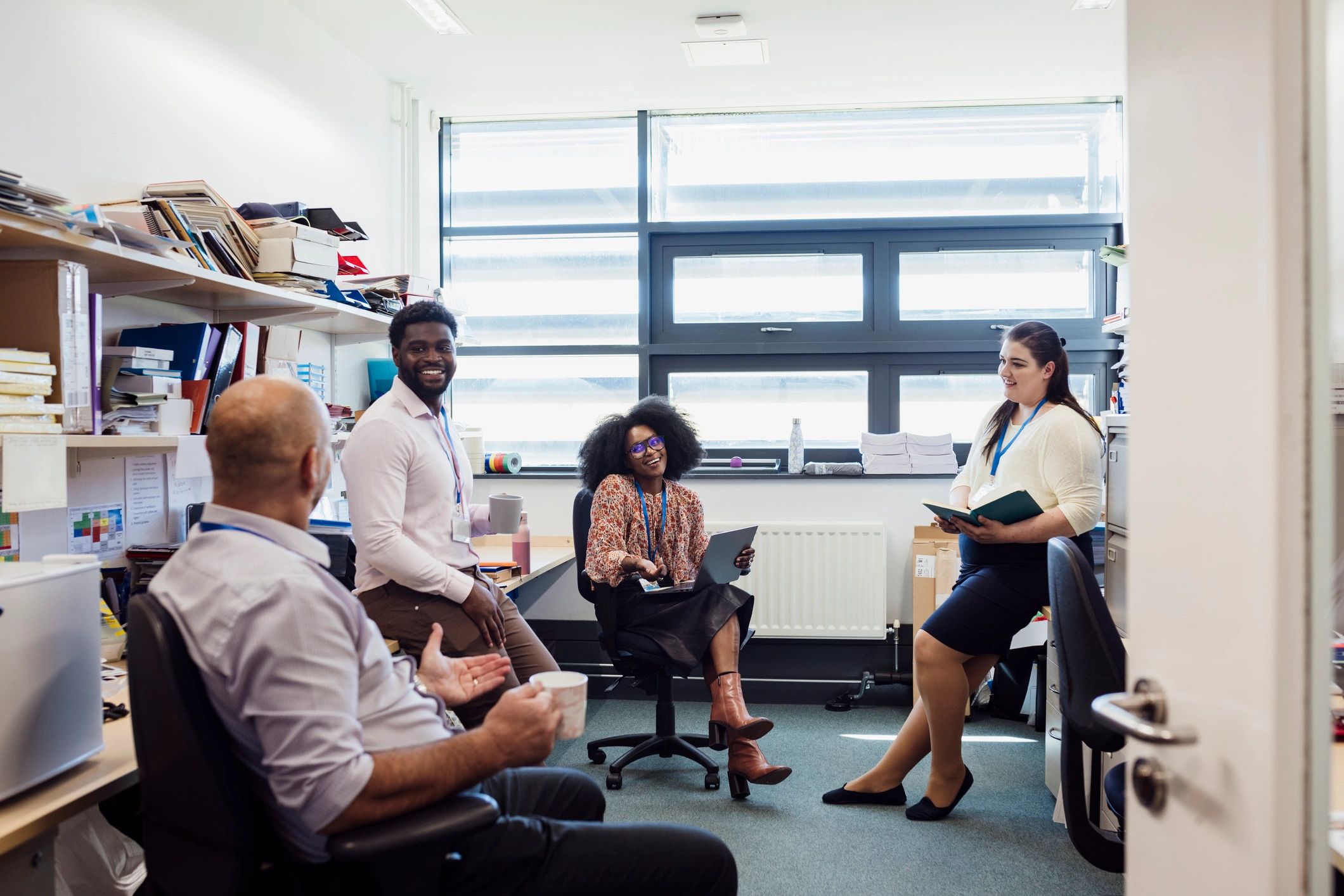 Educators and colleagues connecting in a school setting