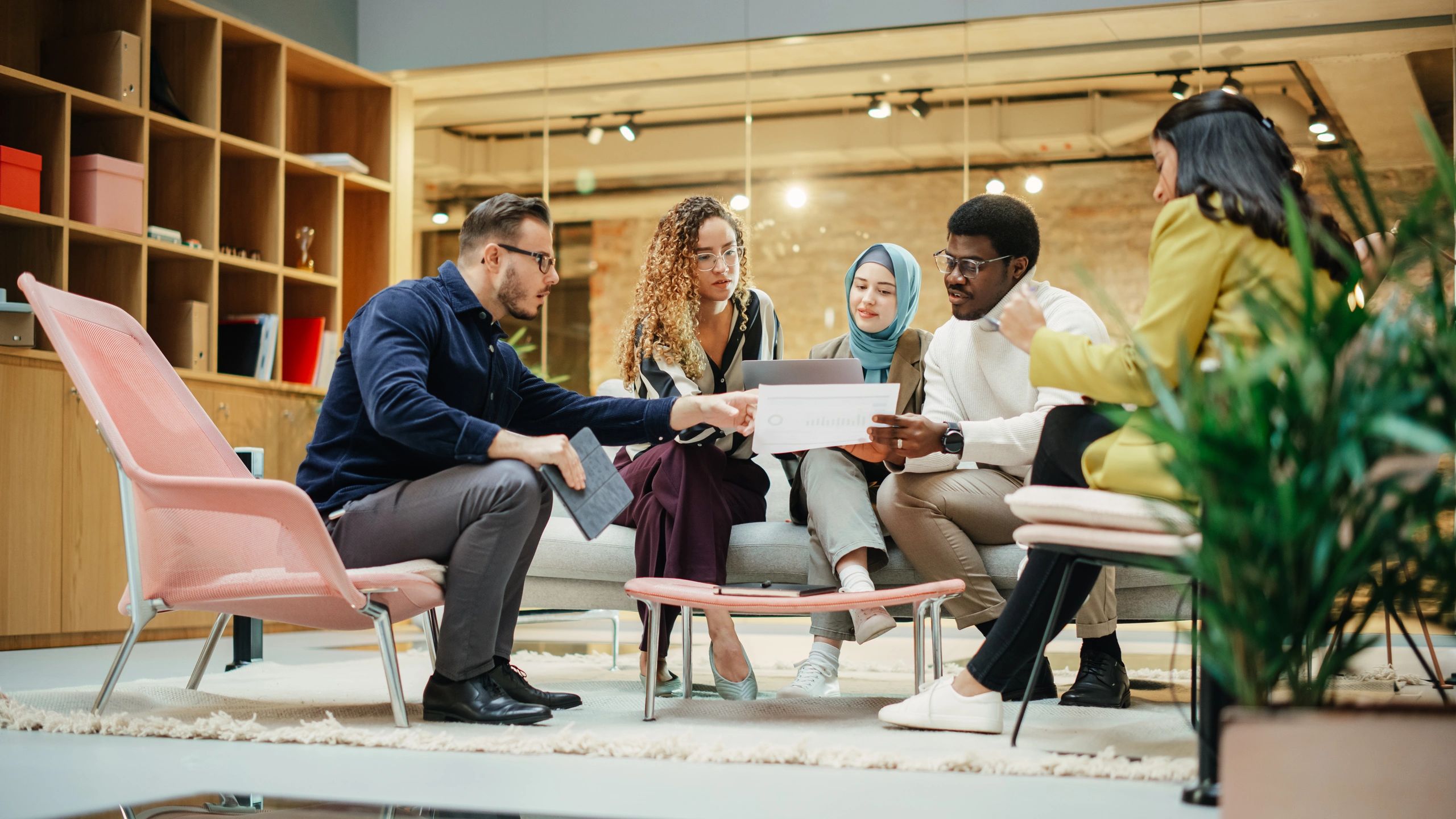 Diverse team preparing a presentation in a conference room