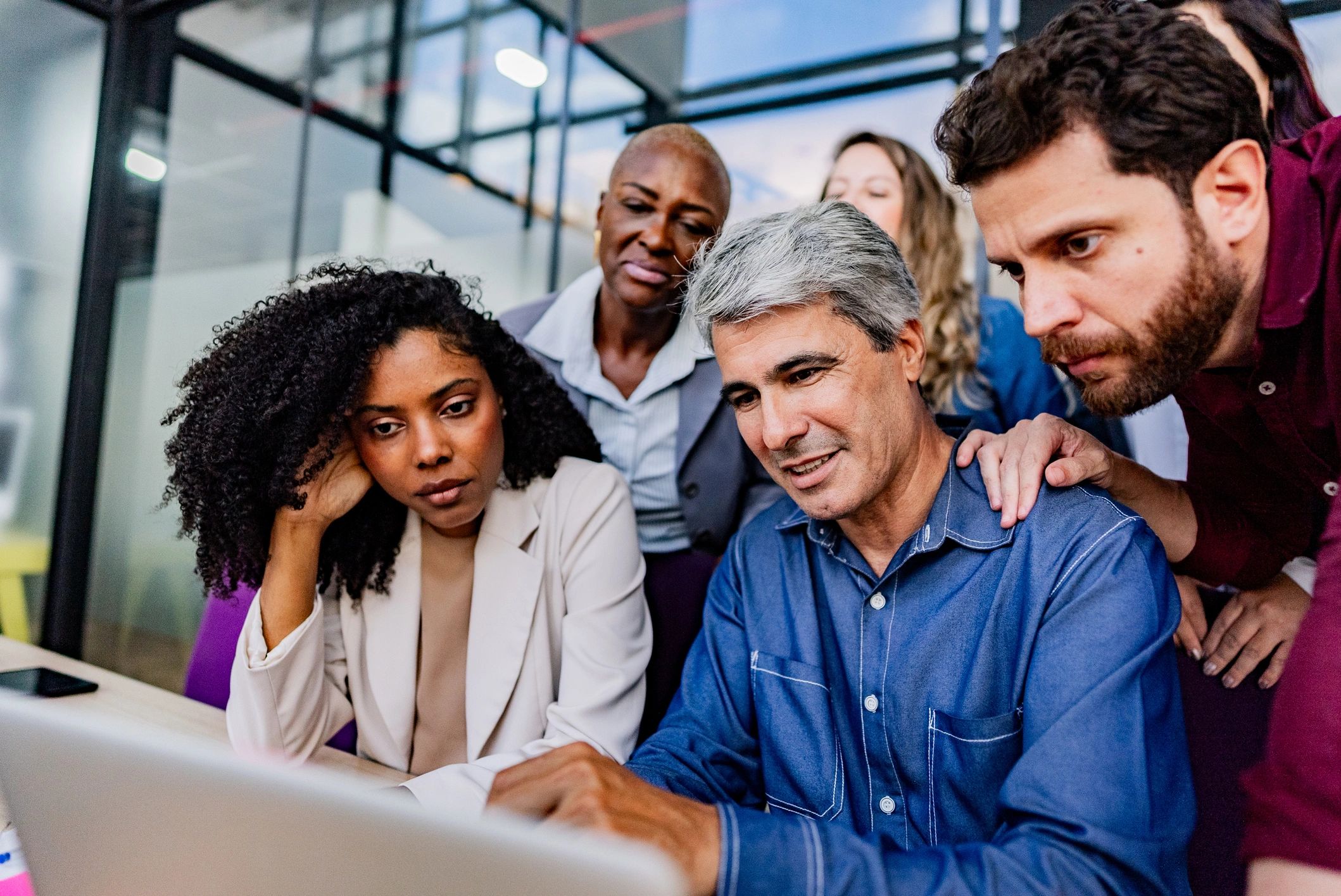 Professionals collaborating in a university-style meeting